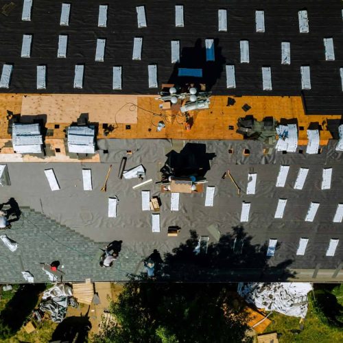 Roofer repair replace shingle that has been damaged and needing replacement