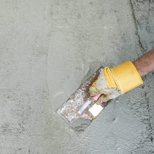 Workman or builder doing plastering